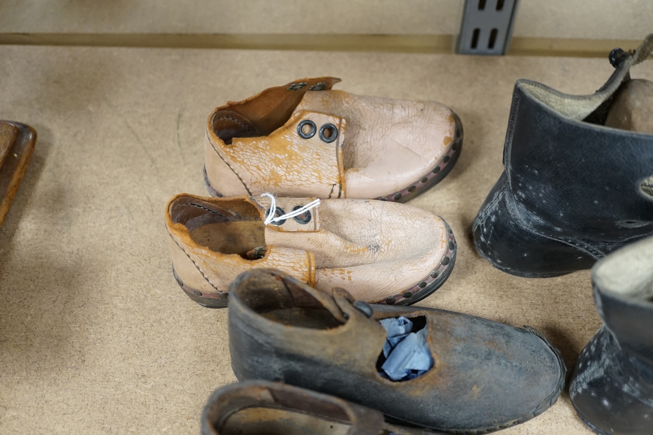 Three pairs of late 19th / early 20th century children’s boots and clogs, largest 14cm in length. Condition - poor to fair